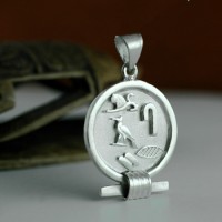 Silver Egyptian circle cartouche.