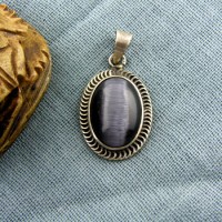 Silver pendant with dark gray multi colored stone & filigree border (jewelry gifts)